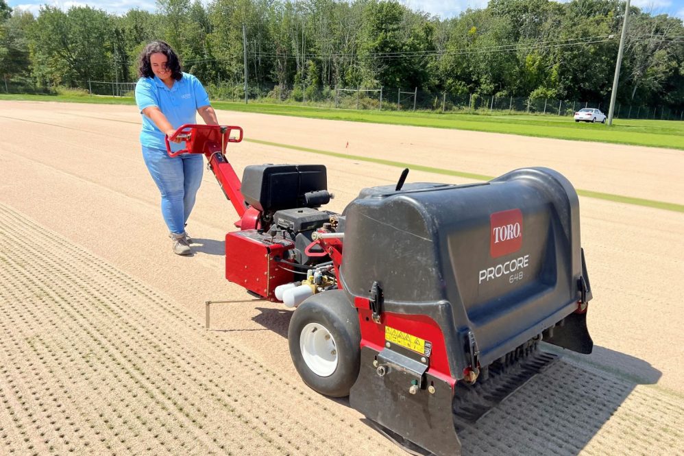 Brianna Collazo working at UConn's Plant Science Research and Education Farm