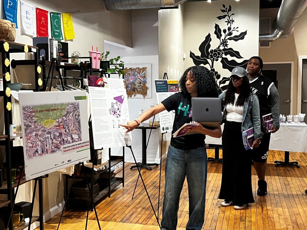 Woman pointing at poster