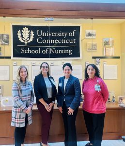 Norma, Meghan, Roxanne, and Clara from Hartford Healthcare posing in Widmer Wing Lobby