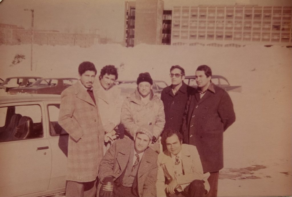 Sepia photograph of six students bundled in winter coats