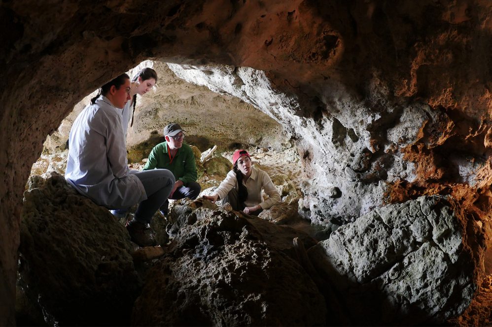 The Early Occupation of Sicily project team is hoping to detail the island's earliest human inhabitants and their impacts on the island ecosystem. Here they are investigating Ice Age hyena coprolites (fossilized feces). From left to right: Iris Querenet Onfroy de Breville, Peyton Carroll, Christian Tryon, and Ilaria Patania.