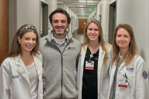 indoor portrait of four physician assistants, three women one man