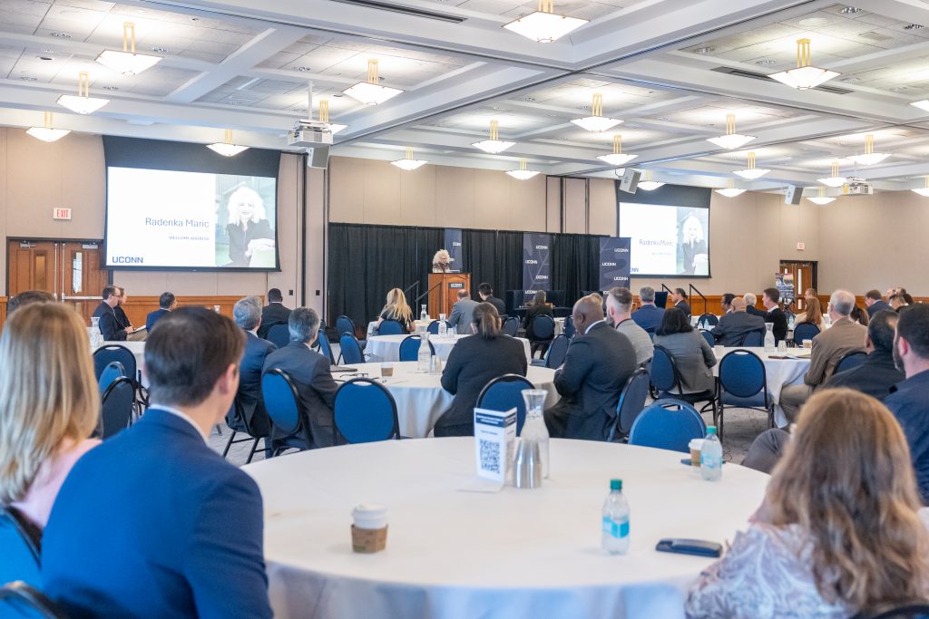 Attendees of the "UConn Forum: Economic Engine of a Thriving Connecticut" event listen to UConn President Radenka Maric speak in the Rowe Commons ballroom.