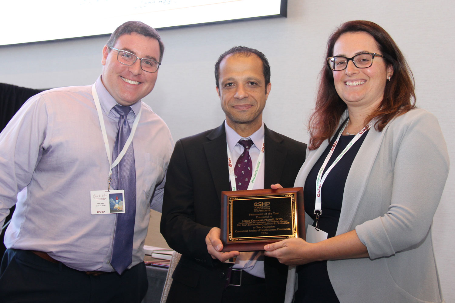 Award presentation with three people