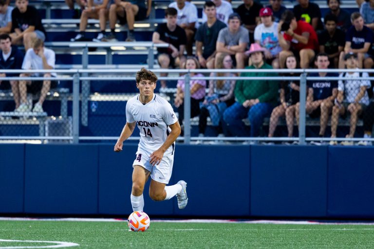 UConn soccer player Jack Loura on the field.