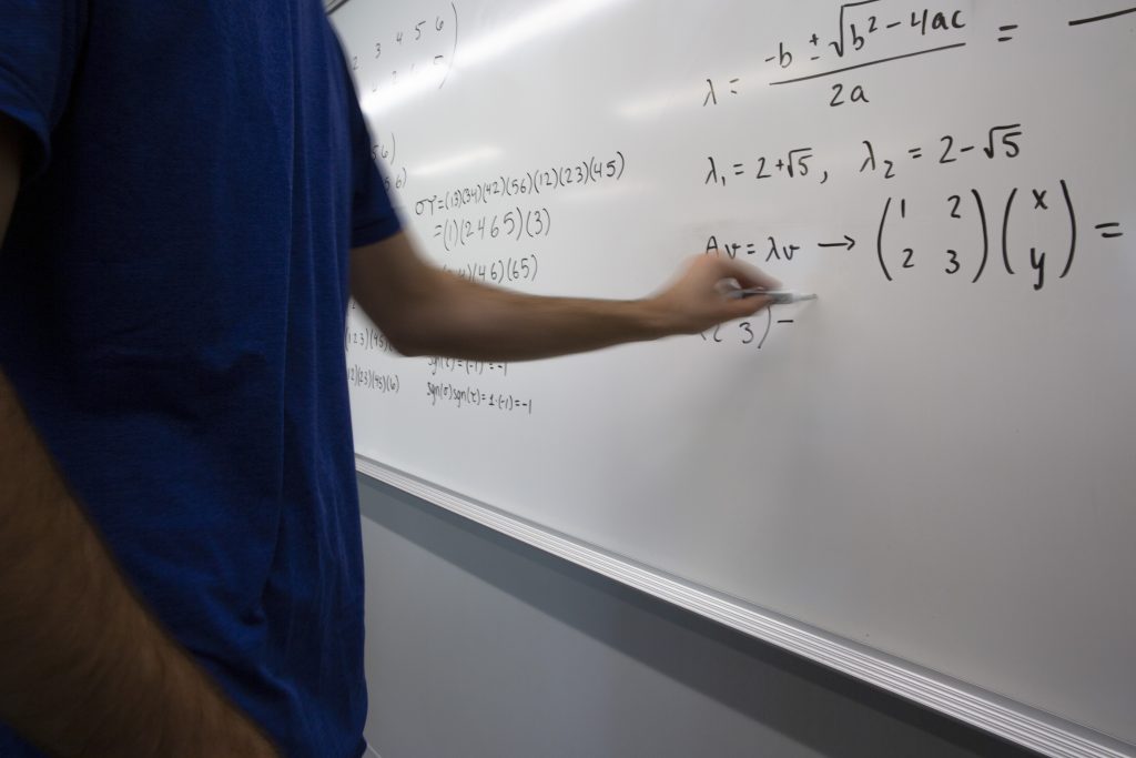 Writing equations on a whiteboard