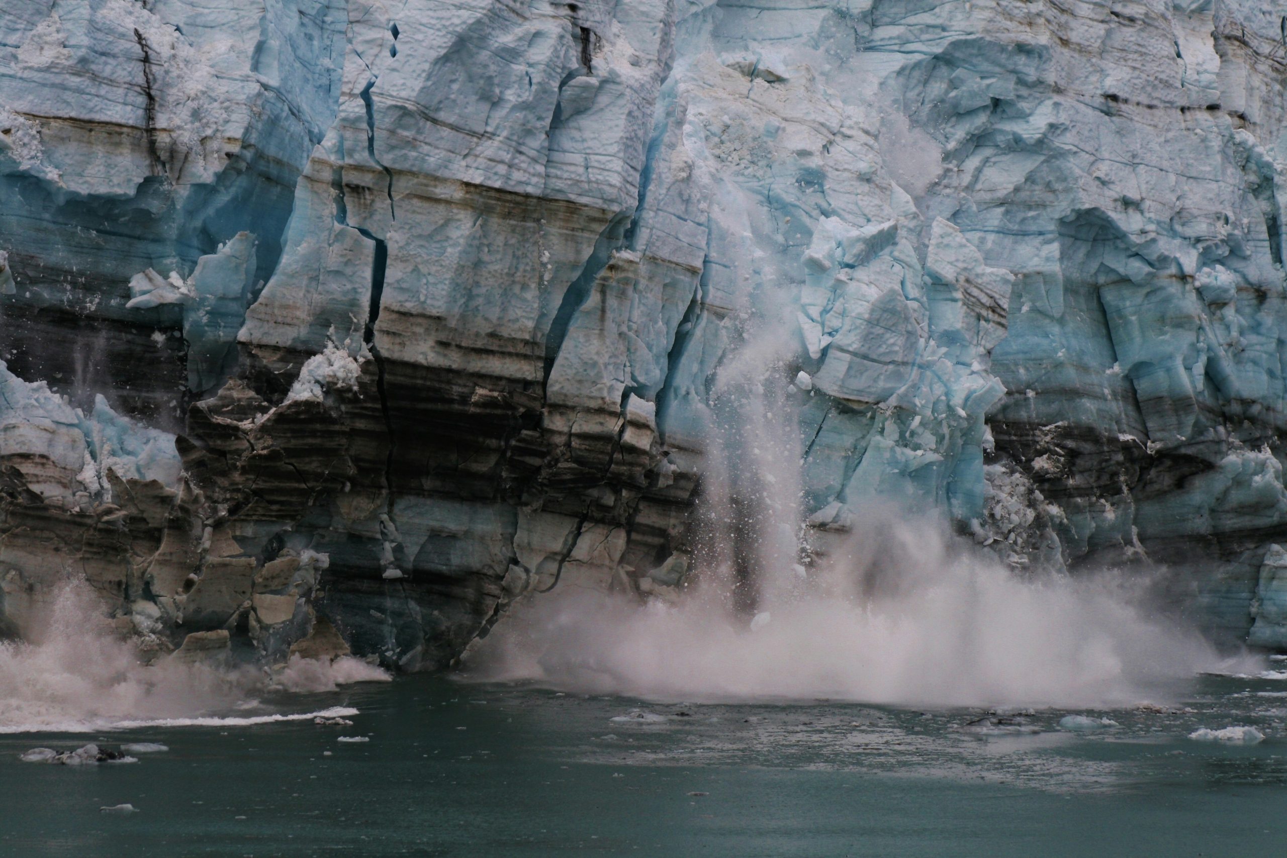 A glacier calving into the sea