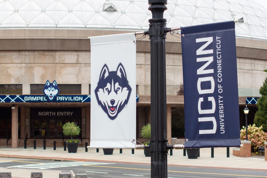 UConn-branded street light banners sit in front of Gampel Pavilion on Sept. 27, 2024.