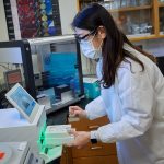 Jiyeon Hyeon, a postdoctoral fellow, works at the Connecticut Veterinary Medical Diagnostic Laboratory on April 7, 2021. (Peter Morenus/UConn Photo)