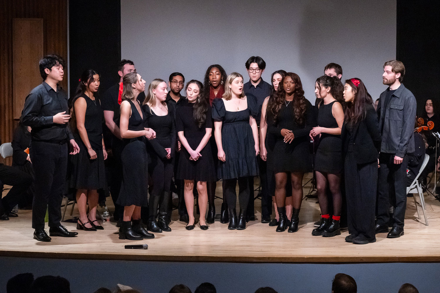 student a cappella group performing on stage