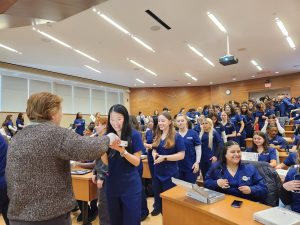 Students lining up to receive stethoscopes