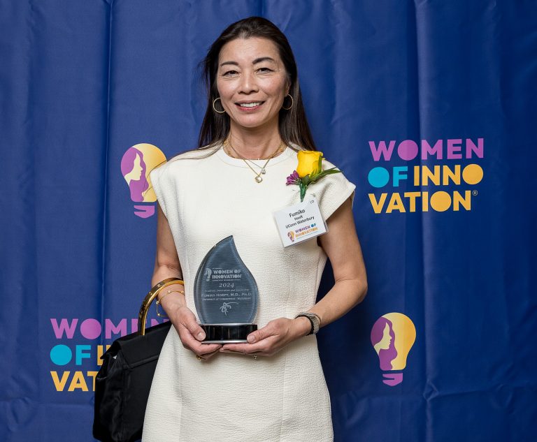 Dean Fumiko Hoeft receives her award.