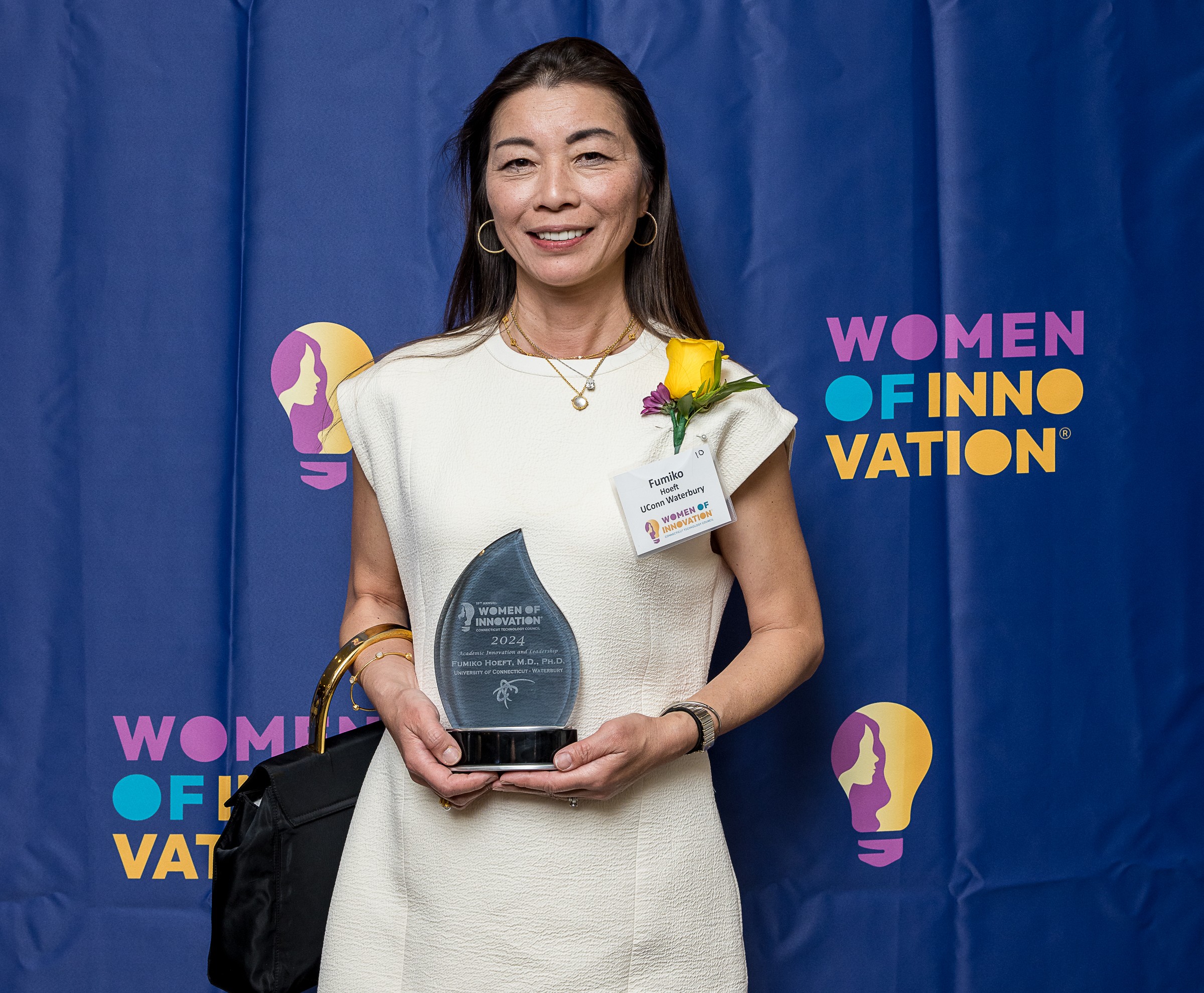 Dean Fumiko Hoeft receives her award.