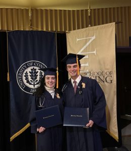 Accelerated BS/CEIN graduate siblings Kaeleigh and Logan Broyles pose with diplomas at graduation