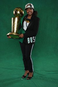 Taylor Kielpinski-Rogers ’12 (ED) holds the Larry O'Brien Championship Trophy