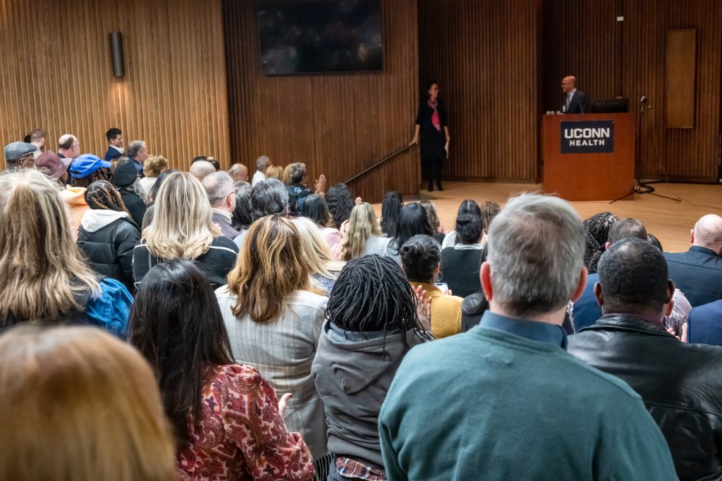 CEO Dr. Andy Agwunobi leading a round of applause for Dr. Biree Andemariam on Jan. 29.