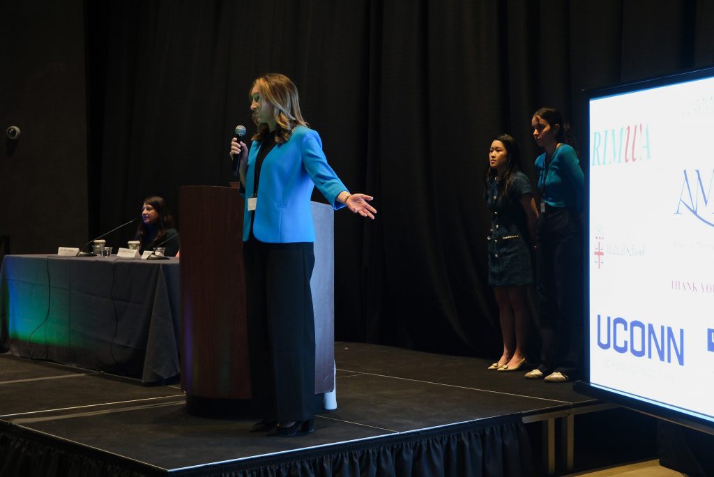 Second-year UConn medical student delivering her opening remarks at New England's American Medical Women’s Association (AMWA) Region 1 conference in Boston. She is the first-ever UConn medical student to be elected to serve as president of AMWA Region 1 ( Photo by Olivia Kuk/Boston University medical student)