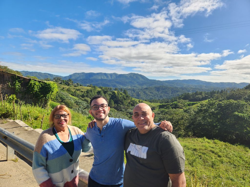 UConn resident Dr. Edison Martinez Monegro with his parents in Puerto Rico (Photo Courtesy of Edison).