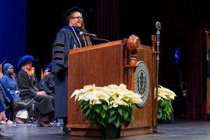 Lucinda Canty giving speech to graduating CEIN/BS students (photo provided by Defining Studios)