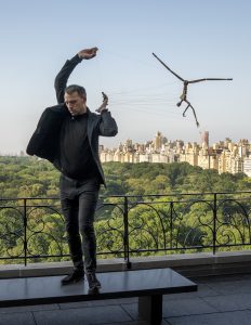 Puppeteer Basil Twist performs with Stickman at a reception in June 2021 at Upper Penthouse, Central Park South, New York City.