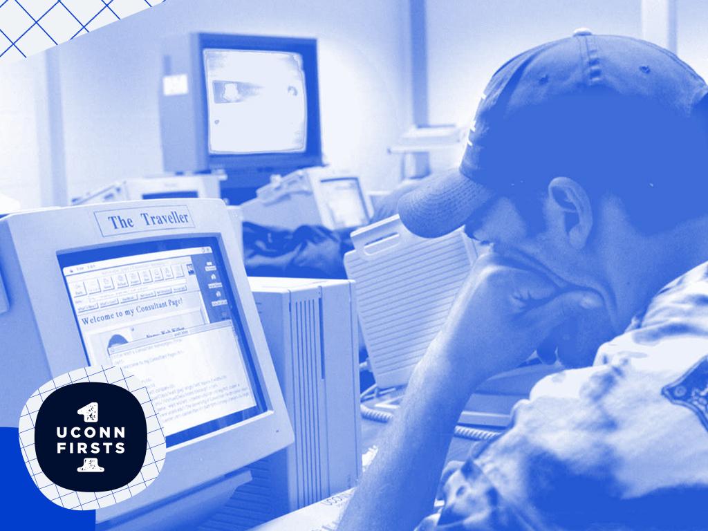 Student studying at a one of the first computers on campus.