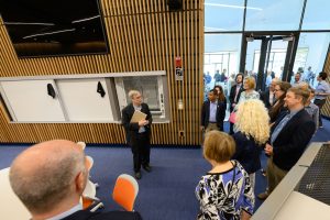 Steve Suib, director of the Institute of Materials Science, leads elected officials on a tour of the Science 1 Research Center 