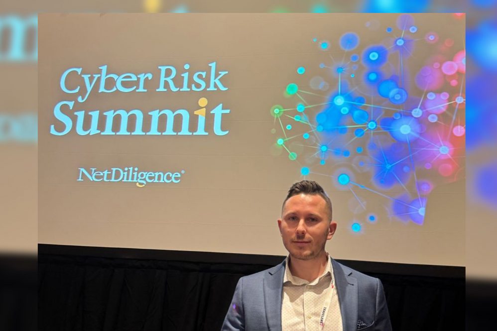 Graduate student Nick Savignano ’25 at the CyberRisk Summit. Contributed Photo)