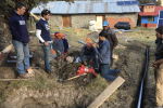 Researchers work in a village in Peru.