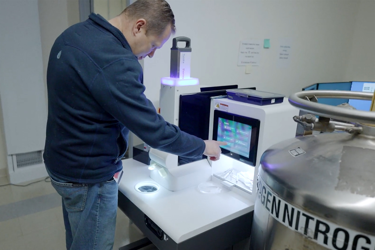 A man working on a computer in a lab