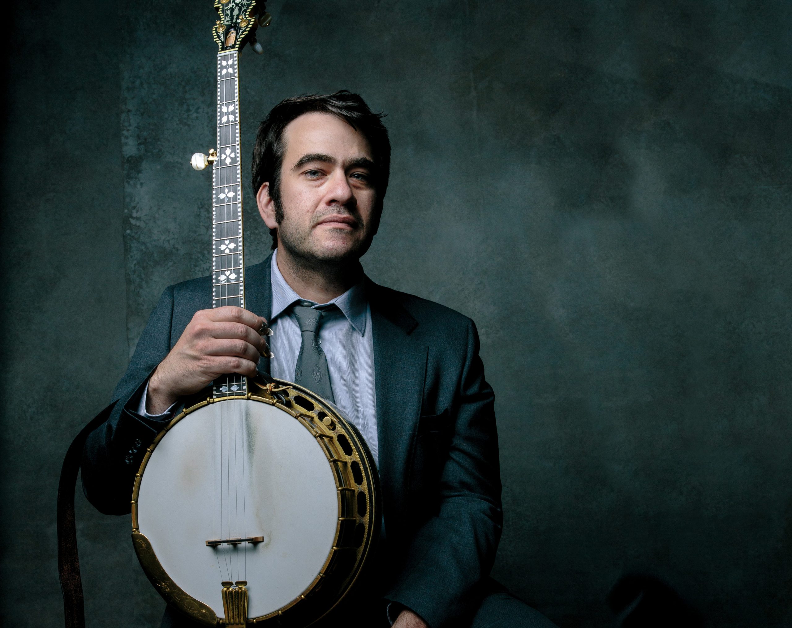 A man holding a banjo.