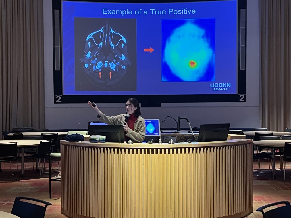 Future radiologist Maxime Braun presenting her capstone project findings on March 7 at UConn School of Medicine on the hot topic of the use of Artificial Intelligence in the field radiology in the Academic Rotunda.