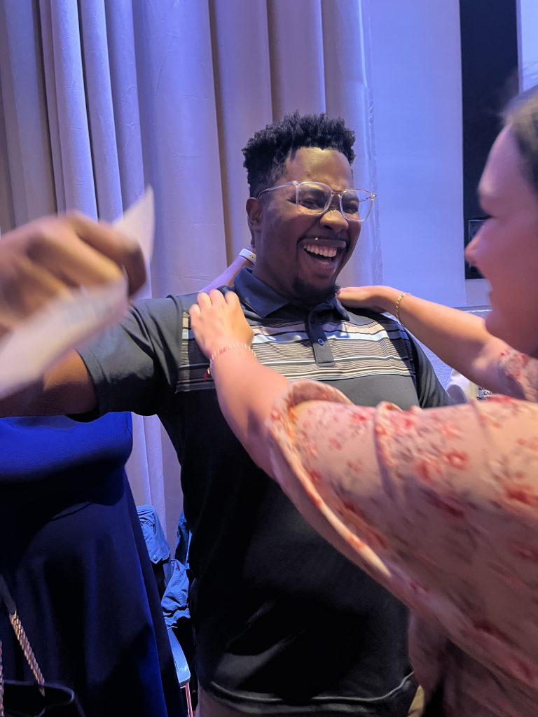 Ireoluwatomiwa Opayemi celebrating his Match Day moment with girlfriend Ellen Fuller, first-year UConn medical student. He learned he is headed to Yale for primary care residency training.