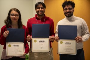 Photo shows top-three poster competition winners, Deniz Ipekci, John Toribio and Sahib Sandhu