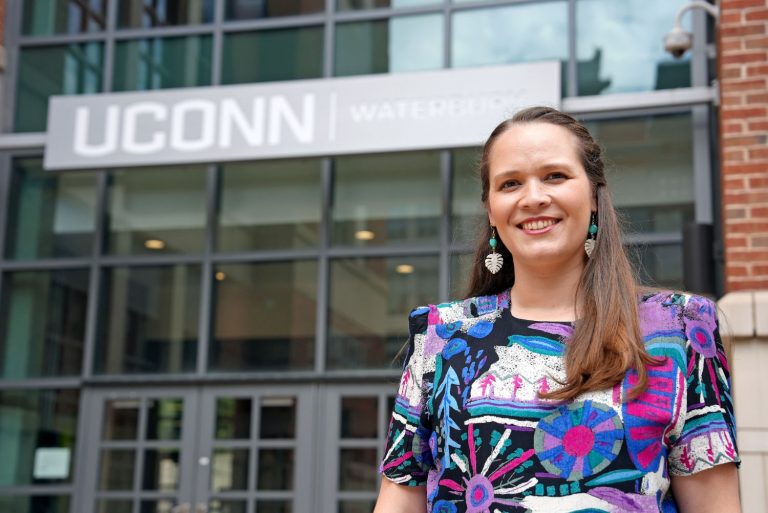 Woman in front of UConn Waterbury
