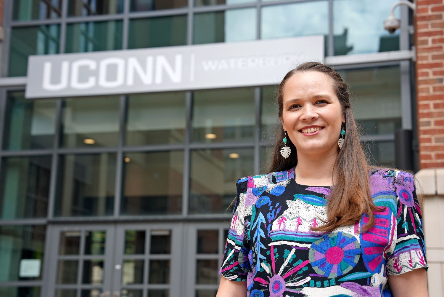 Woman in front of UConn Waterbury