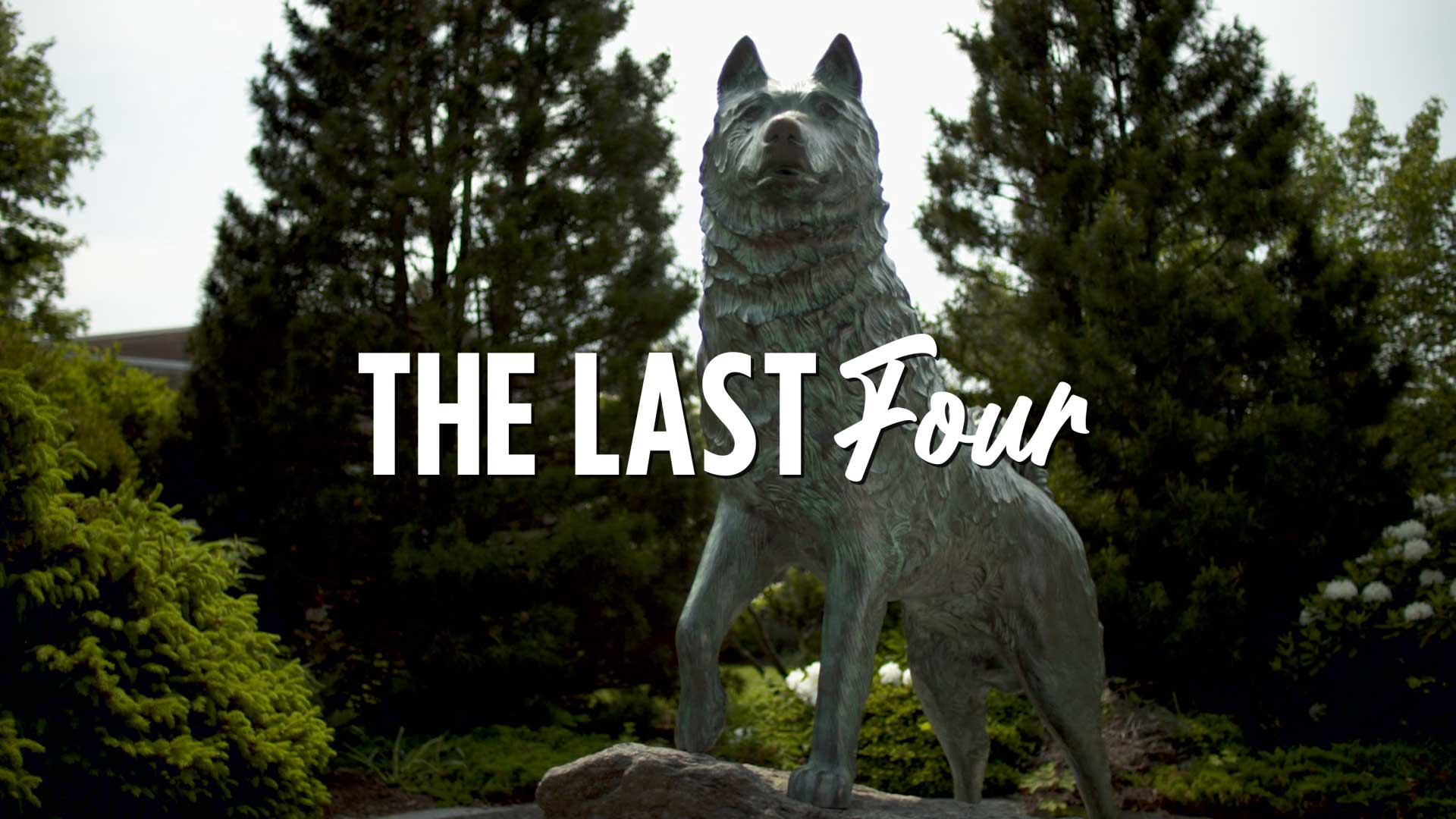 Jonathan Husky statue with the words "The Last Four" written over it
