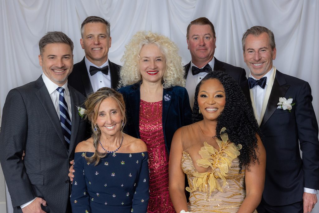 The School of Business inducted five outstanding business leaders into its 'Hall of Fame' on Friday. Seated from left: Laurie Havanec '82, '94 JD and Trisha Bailey, Ph.D. '99, '23 H. Standing (from left): Interim Dean Greg Reilly; Gregory Lewis '91; UConn President Radenka Maric; Robert Skinner '93 and John Hodson '85.