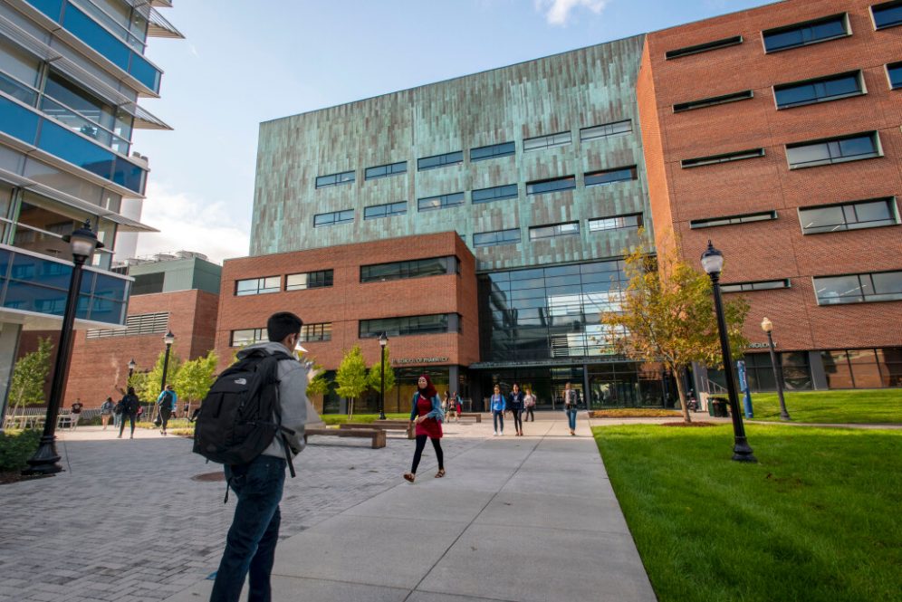 Students walking to and from the School of Pharmacy building on (UConn Photo)