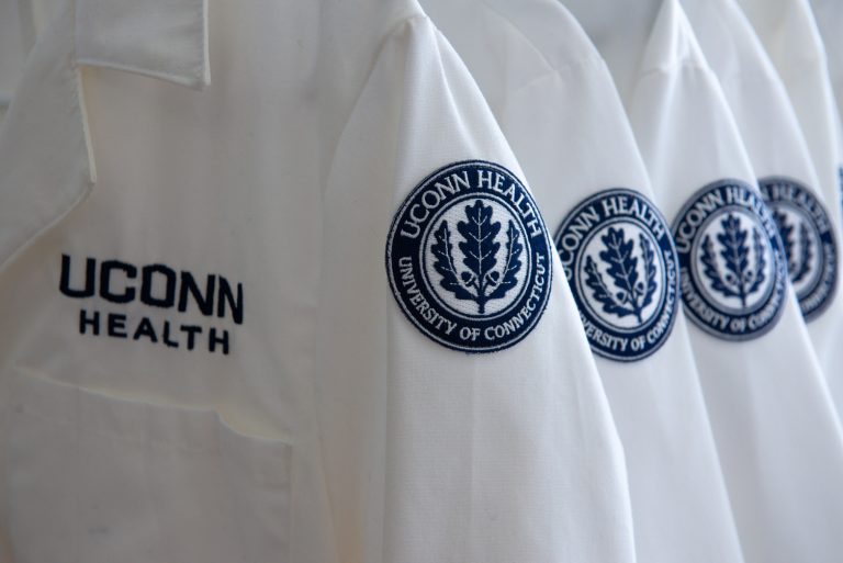 UConn Health lab coats with the logo and seal on August 15, 2018