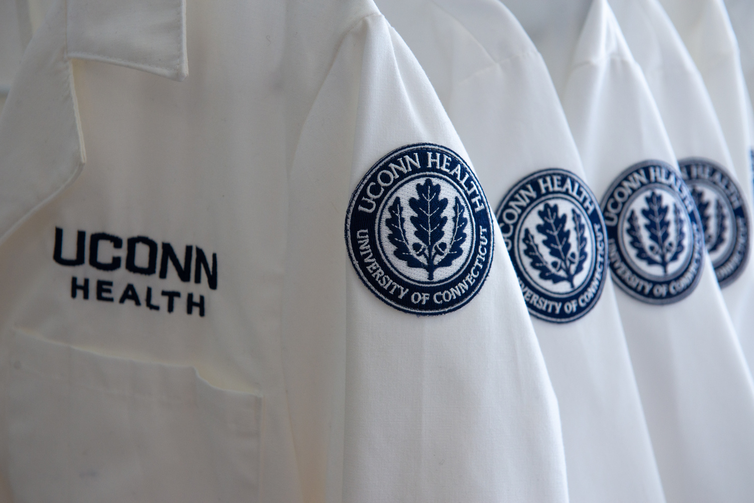 UConn Health lab coats with the logo and seal on August 15, 2018