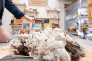 A pile of wool sits on a table