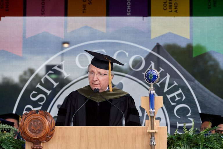 Dean Hritcko speaks during the Commencement ceremony in 2021 (Peter Morenus/UConn Photo)