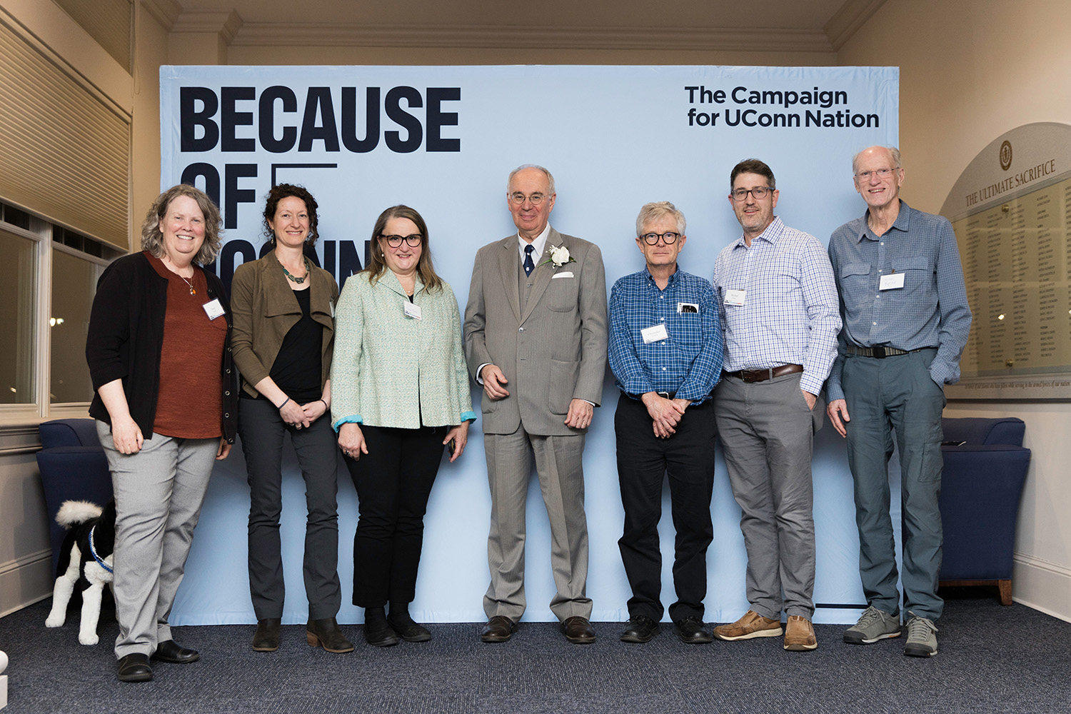 Kevin Bohacs ’76 (CLAS) and family stand in front of a backdrop that reads "The Campaign for UConn Nation."