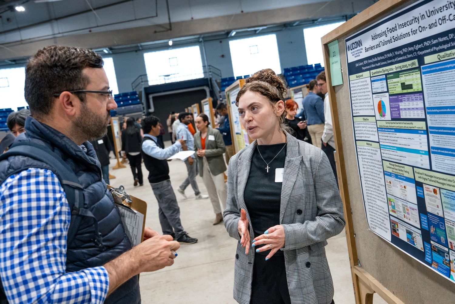 Woman presenting a research poster