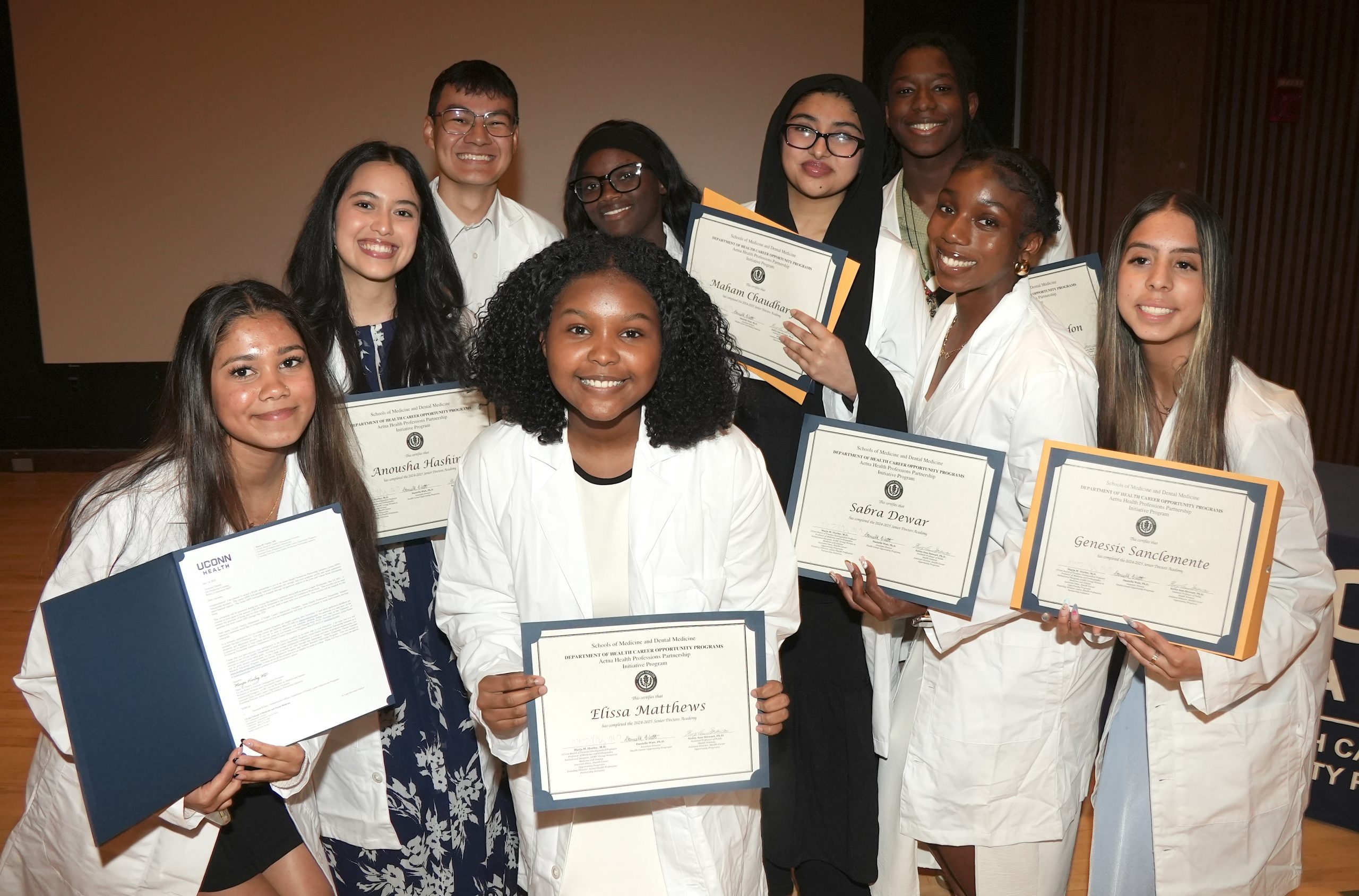 Connecticut high school seniors celebrating their successful graduation from the Senior Doctors Academy of the Health Career Opportunities Programs (HCOP) of UConn Health on May 14, 2025 (Photo by John Atashian).
