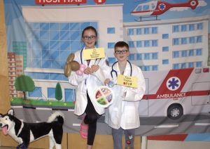 Brooklynn and Dean Kiley at the health careers photobooth. (One of the faculty, Nicole Gallagher, has obtained an emailed permission from the kids' mom, Cassie Kiley, to publish this picture.)