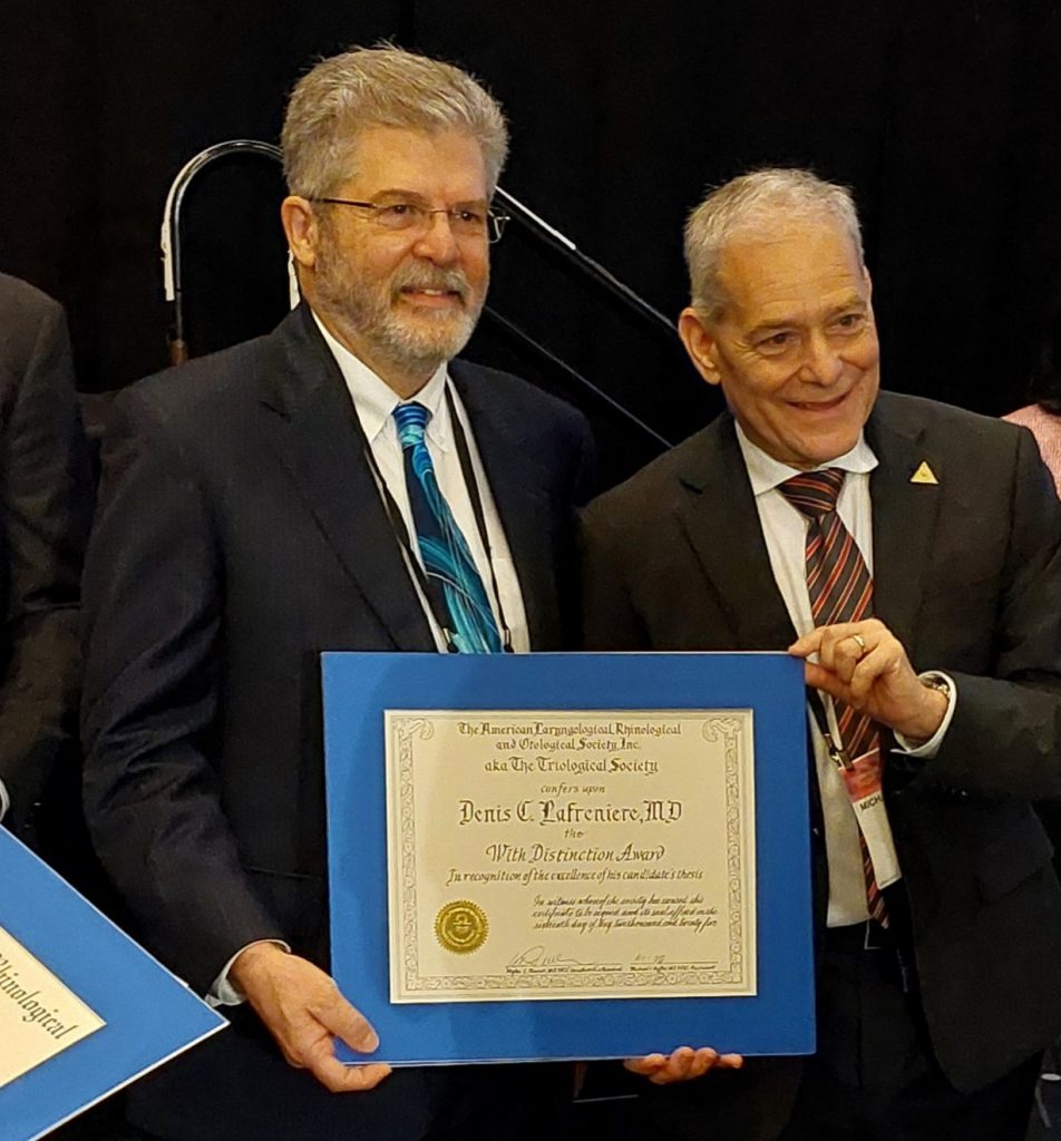 Dr. Denis Lafreniere on May 16 in NEw Orleans being honored with the With Distinction Award for his excellent research thesis by the President of the Triological Society, Dr. Michael Hoffer.