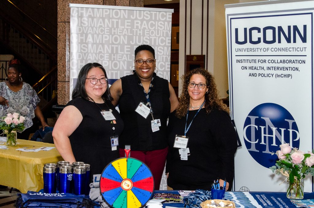 Yukiyo Iida, associate director of Parent Leadership and Family Engagement with the Connecticut General Assembly's CWCSOEO with UConn Health Disparities Institute's Trisha Pitter and Dr. Linda Sprague Martinez.