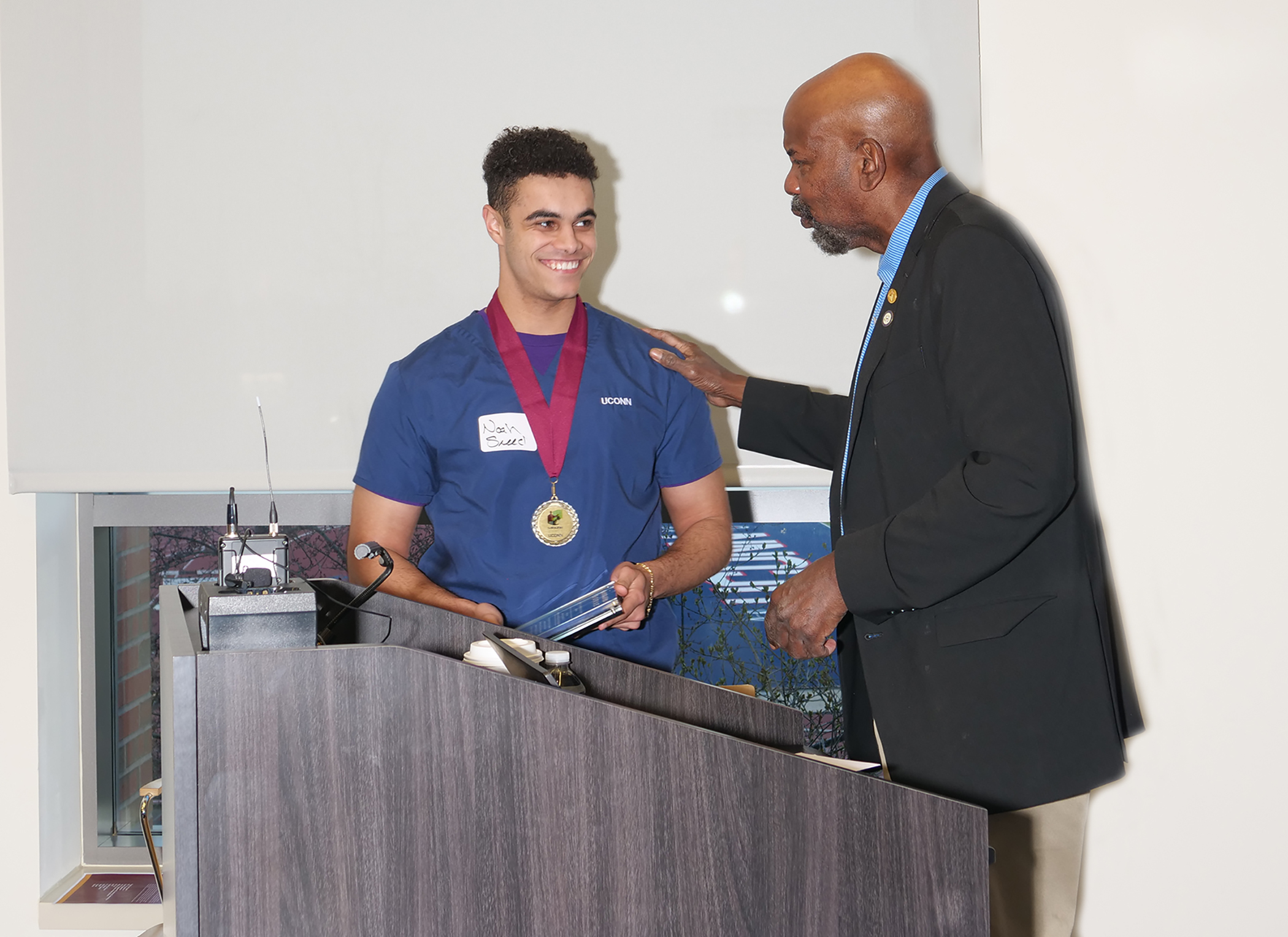 UConn senior Noah Sneed with Dr. Cato T. Laurencin.