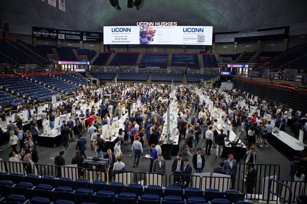 The floor of Gampel pavilion teaming with students, shot from the mezzanine above.